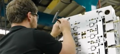 A man working on an electrical panel.