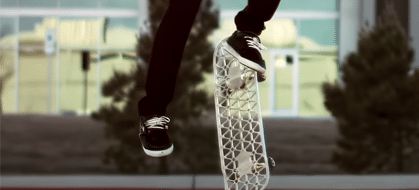 A person jumping in the air with their skateboard.